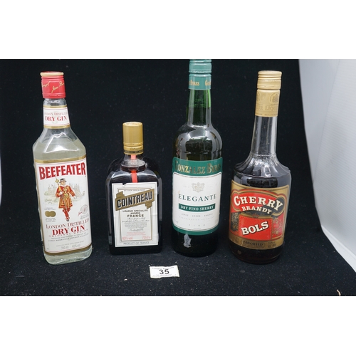 35 - Selection of spirits to include Beefeater Gin, Cointreau, Cherry and Bols Cherry Brandy