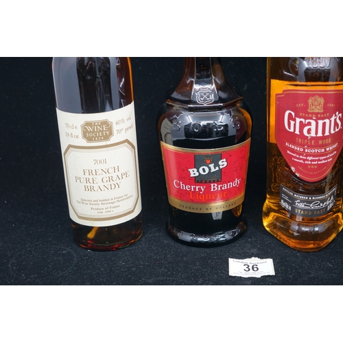 36 - 4 bottles of spirits to include Grants scotch whisky, French pure grape Brandy, Cherry Bols and Dry ... 