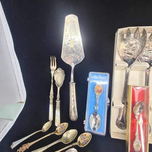 75a - Collection of vintage and ornate cutlery.  Assortment includes spoons, forks, knives, serving utensi... 