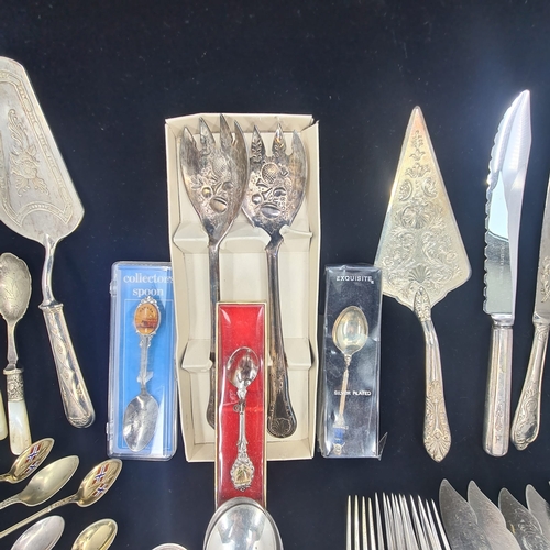 75a - Collection of vintage and ornate cutlery.  Assortment includes spoons, forks, knives, serving utensi... 