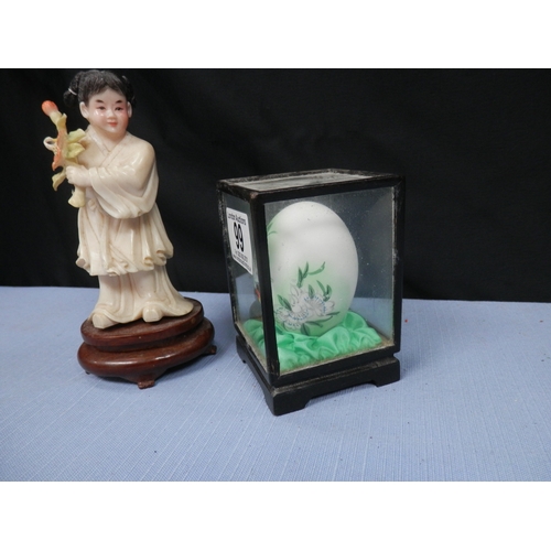 99 - Oriental Figure on wooden stand and Vintage Hand Painted Egg in a Glass Display Box