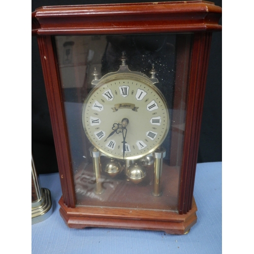 157c - Two clocks: a London Clock Co. quartz clock and another