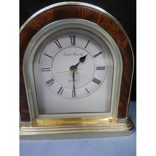 157c - Two clocks: a London Clock Co. quartz clock and another