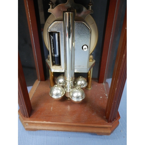 157c - Two clocks: a London Clock Co. quartz clock and another