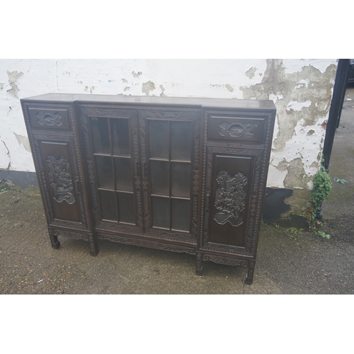 449 - A Chinese ebonised breakfront display cabinet