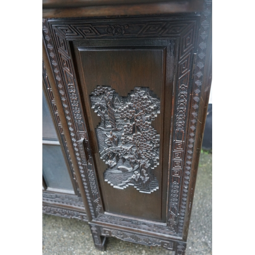 449 - A Chinese ebonised breakfront display cabinet