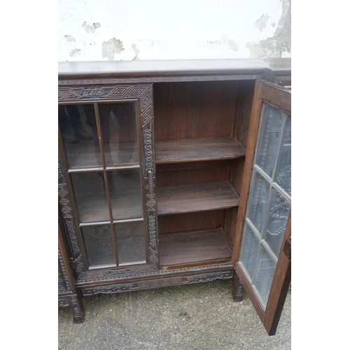 449 - A Chinese ebonised breakfront display cabinet