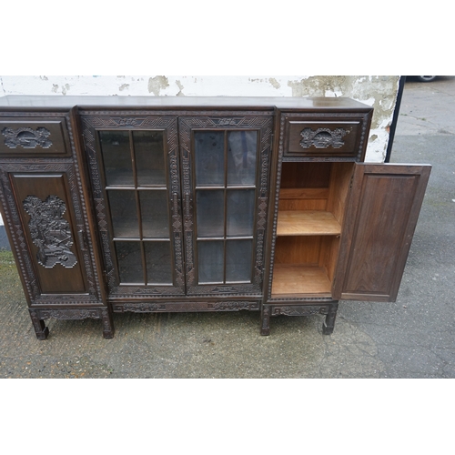 449 - A Chinese ebonised breakfront display cabinet