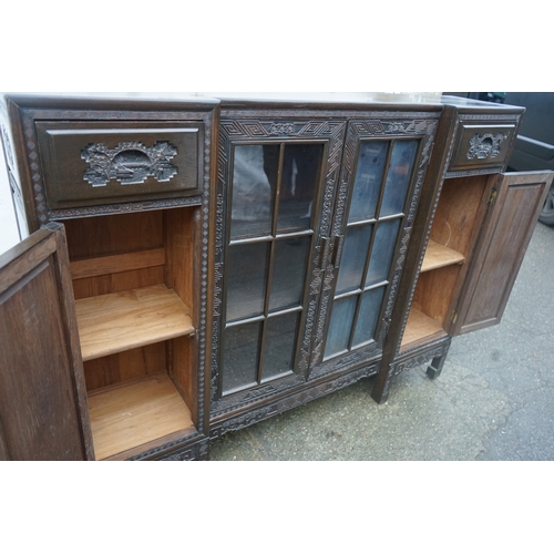 449 - A Chinese ebonised breakfront display cabinet