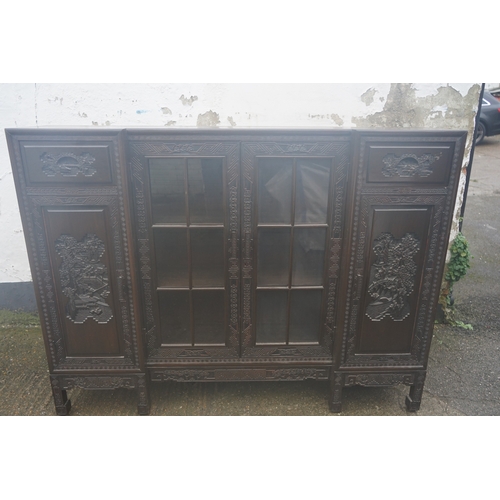 449 - A Chinese ebonised breakfront display cabinet