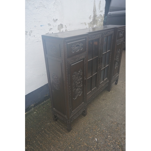 449 - A Chinese ebonised breakfront display cabinet