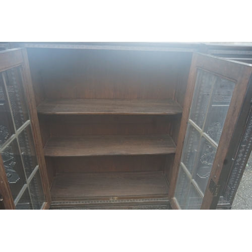 449 - A Chinese ebonised breakfront display cabinet