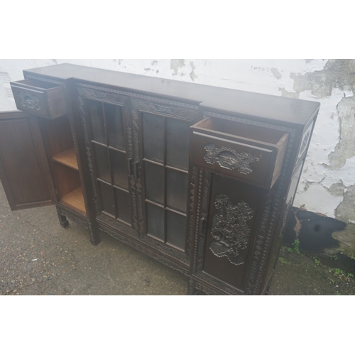 449 - A Chinese ebonised breakfront display cabinet