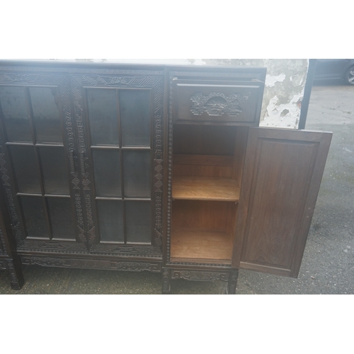 449 - A Chinese ebonised breakfront display cabinet