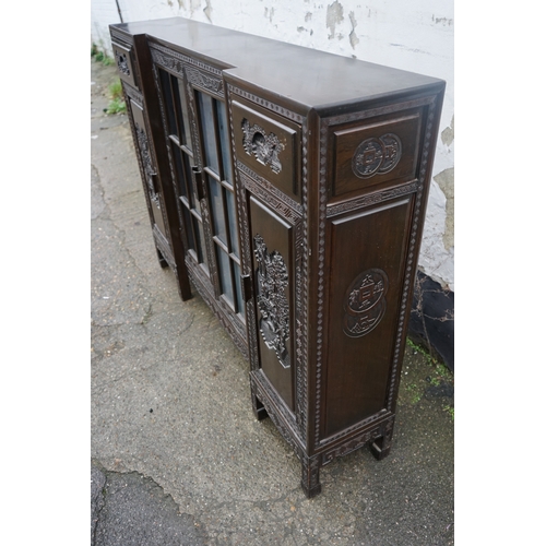 449 - A Chinese ebonised breakfront display cabinet