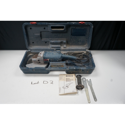 451 - Bosch GWS 20-230 angle grinder with case, manual, and accessories.