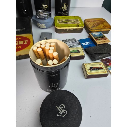 56B - Selection of smoking related items including lighters, cigarette tins, match boxes etc.