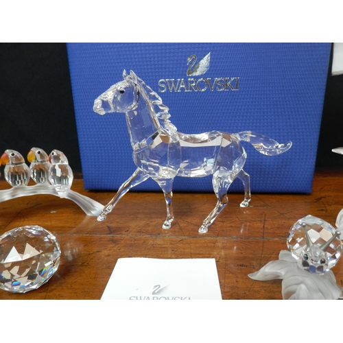 43 - Mint & Boxed 9.5cm Swarovski Horse (5135910) together with Three unboxed Swarovski Figures