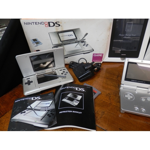 244 - Nintendo DSi Boxed together with another Nintendo DS, a selection of Games, a Game Boy Advance SP an... 