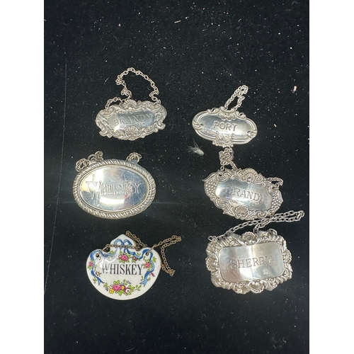 307A - Group of Four Hallmarked Silver Decanter Tags, One Plated Example and an Enamelled Example (6)