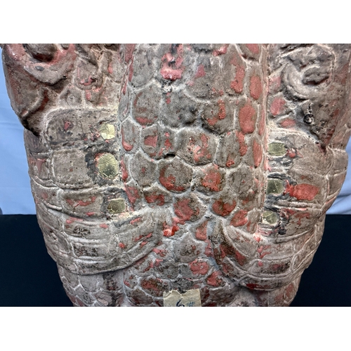 276 - A 15th/16th Century Ayuthia Period Seated Stone Buddha, thickly covered with lacques, red paint & go... 