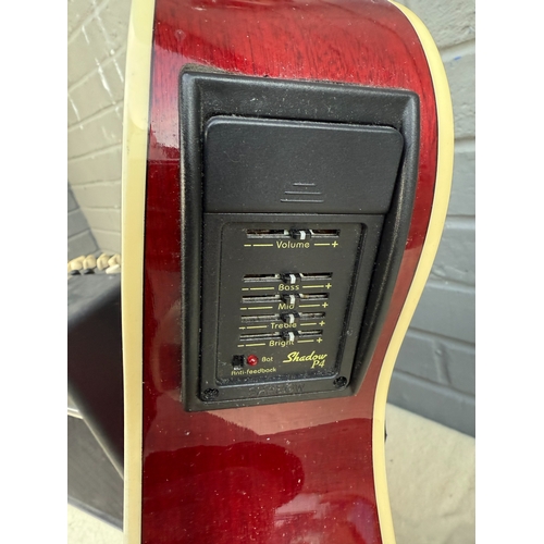 747 - Legacy Acoustic Guitar with Pickup together with a Vox Amplifier