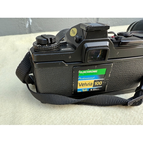 794D - Camera Bag containg an Olympus OM-4, Spare Lenses and Film