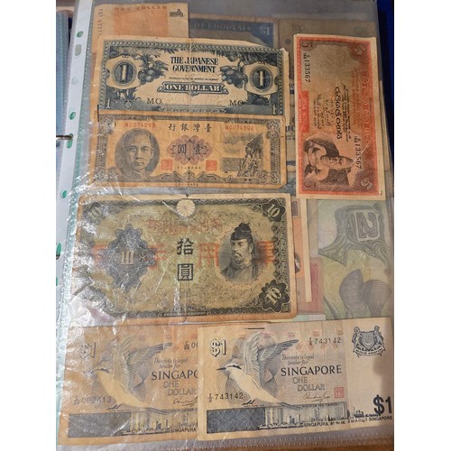 10A - 2x albums containing a large qty of vintage world banknotes