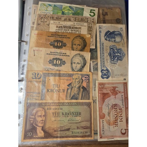 10A - 2x albums containing a large qty of vintage world banknotes