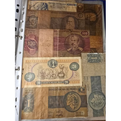 10A - 2x albums containing a large qty of vintage world banknotes