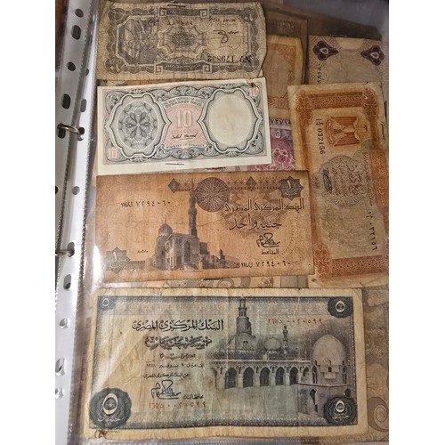 10A - 2x albums containing a large qty of vintage world banknotes