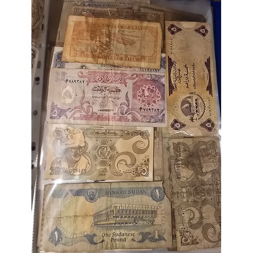 10A - 2x albums containing a large qty of vintage world banknotes