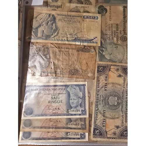 10A - 2x albums containing a large qty of vintage world banknotes