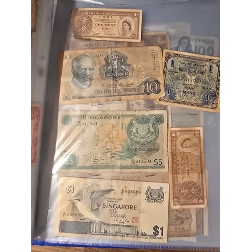 10A - 2x albums containing a large qty of vintage world banknotes