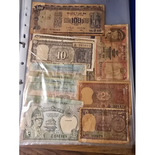 10A - 2x albums containing a large qty of vintage world banknotes