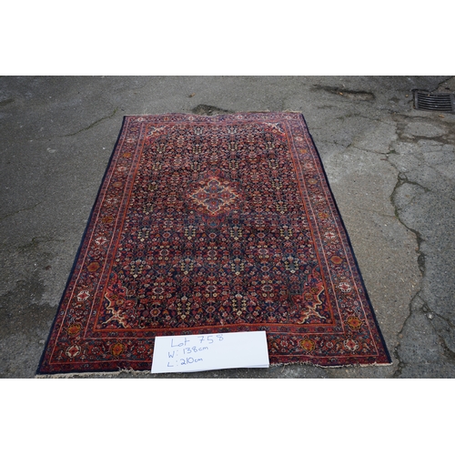 1D - A Persian Sarouk Rug with Herati Design to to central pale blue medallion and indigo field. The main... 