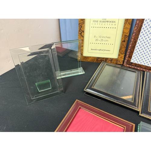 65 - Shelf of Very Good Quality Photo Frames including an example with 22ct Gold Enamel, Dorvilliers of P... 