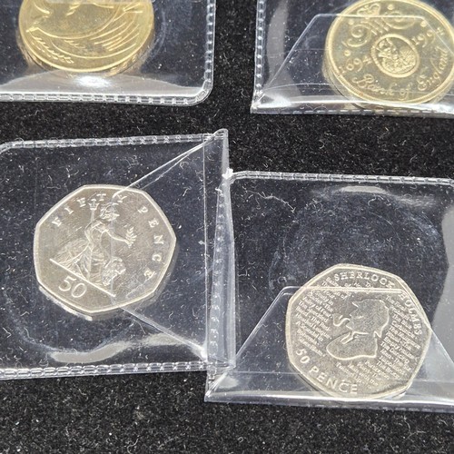 43 - A Collection of Twelve UK Commemorative Coins to include £5 coins, £2 coins etc