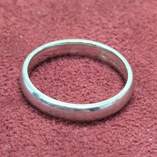 78 - A 9ct White Gold Wedding Band (4.7g), a Platinum Wedding Band (3.23g) and a Yellow Metal Baby's Brac... 