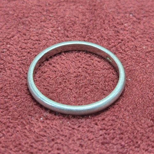 78 - A 9ct White Gold Wedding Band (4.7g), a Platinum Wedding Band (3.23g) and a Yellow Metal Baby's Brac... 