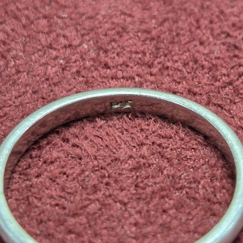 78 - A 9ct White Gold Wedding Band (4.7g), a Platinum Wedding Band (3.23g) and a Yellow Metal Baby's Brac... 