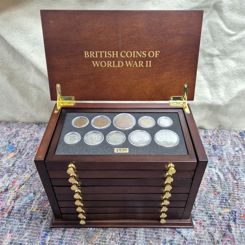 74 - British Coins of World War II set (1939-1945) A complete 7-drawer collector's cabinet containing Bri... 
