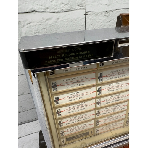 A Vintage 1970s Rock-ola 507 Jukebox Wallbox with Original Manual