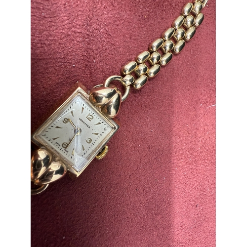 22I - A 9ct Yelow Gold Ladies Longines Wrist Watch On A 12ct Rolled Gold Bracelet, Swiss Made Manual Windi... 