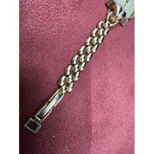 22I - A 9ct Yelow Gold Ladies Longines Wrist Watch On A 12ct Rolled Gold Bracelet, Swiss Made Manual Windi... 