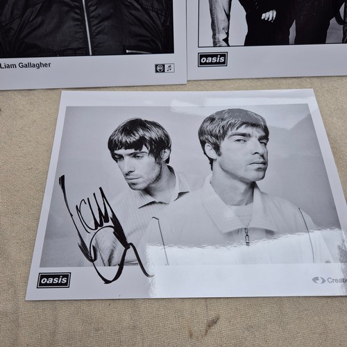 213 - Oasis - Three Official Promotional Photos Signed by Liam Gallagher