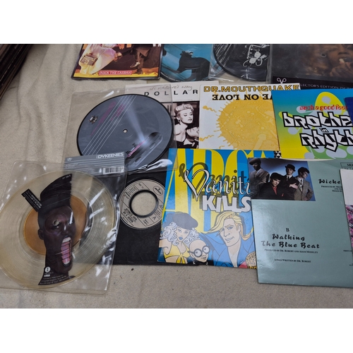 144 - A Mixed Lot of Vinyl Singles to include Picture Discs