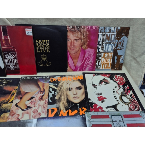 147 - A Good Collection of Vinyl Records to include Eurythmics, Dire Straits and others
