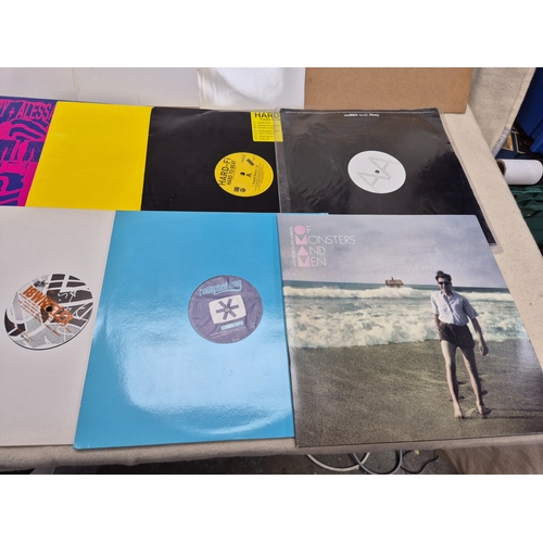148 - An Interesting Lot of Vinyl Records and Singles to include Promos and similar