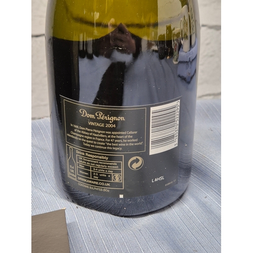 731 - A 75cl Bottle of Dom Perignon 2004 Champagne with Box and Booklet
